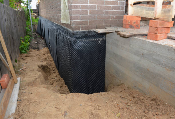 Happy homeowners after waterproofing job in Bellbrook